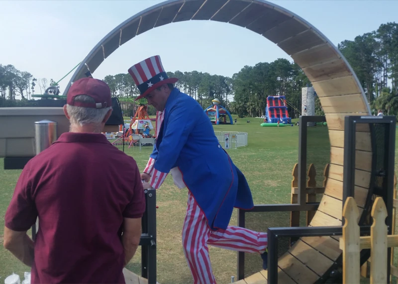 Uncle Sam walking in the human hamster wheel snow cone machine rental