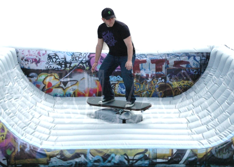 Sidewalk surfer riding the mechanical skateboard rental over a soft landing cushion