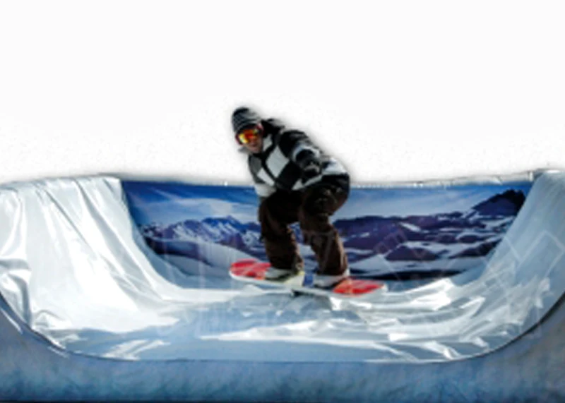 Guest riding the mechanical snowboard rental at a Florida winter-themed event