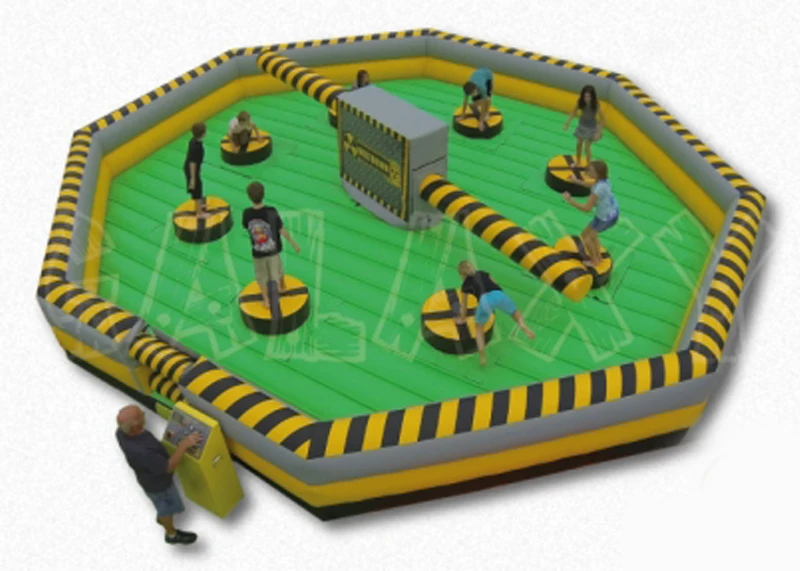 Eight players jumping the spinning sweeper arms of the Toxic Meltdown ride rental